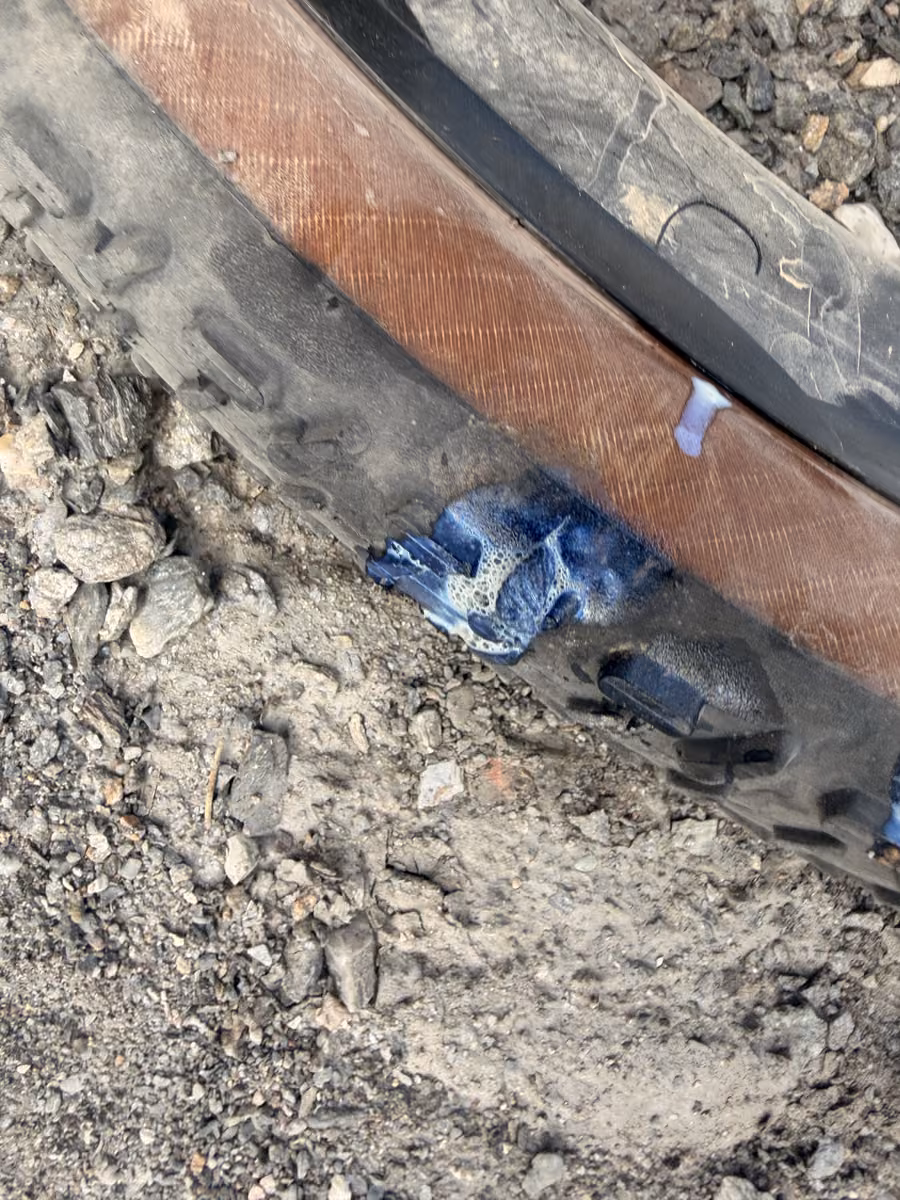 A close-up of blue plug material in the rear tire.